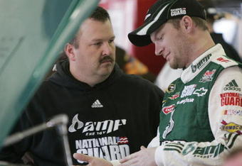 ATLANTA, GA - MARCH 06:  Dale Earnhardt Jr. driver of the #88 AMP Energy/National Guard Chevrolet talks with crew chief Tony Eury Jr. during practice for the NASCAR Sprint Cup Series Kobalt Tools 500 at the Atlanta Motor Speedway on March 6, 2009 in Hampton, Georgia.  (Photo by Jerry Markland/Getty Images)