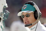 DENVER - DECEMBER 12:  Head coach Jim Bates of the Miami Dolphins pumps up his team before a game against the Denver Broncos in the second quarter on December 12, 2004 at Invesco Field at Mile High Stadium in Denver, Colorado.  (Photo by Brian Bahr/Getty Images)
