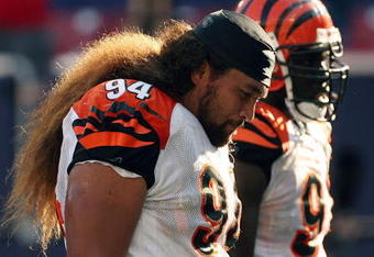 EAST RUTHERFORD, NJ - SEPTEMBER 21:  Domata Peko #94 of the Cincinnati Bengals walks off the field after the loss against the New York Giants on September 21, 2008 at Giants Stadium in East Rutherford, New Jersey. The Giants defeated the Bengals 26-23 in overtime.  (Photo by Elsa/Getty Images)