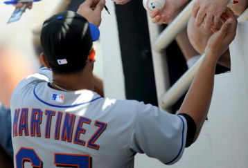 FORT LAUDERDALE, FL - FEBRUARY 25: Fernando Martinez #67 of the New York Mets signs autographs before a game against the Baltimore Orioles during spring training at Fort Lauderdale Stadium on February 25, 2009 in Fort Lauderdale, Florida. (Photo by Rob Tringali/Getty Images)