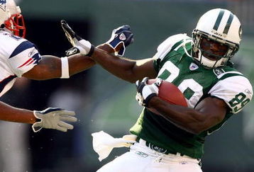 EAST RUTHERFORD, NJ - SEPTEMBER 17:  Wide receiver Jerricho Cotchery #89 of the New York Jets pushes away cornerback Asante Samuel #22 of the New England Patriots during the second quarter of the game on September 17, 2006 at Giants Stadium in East Rutherford, New Jersey.  (Photo by Al Bello/Getty Images)