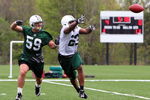 FLORHAM PARK, NJ - MAY 02:  Shonn Greene #23 of the New York Jets practices against Brian Toal #59 during minicamp on May 2, 2009 at the Atlantic Health Jets Training Center in Florham Park, New Jersey.  (Photo by Jim McIsaac/Getty Images)