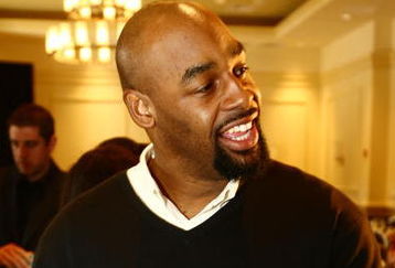 TAMPA, FL - JANUARY 31: Philadelphia Eagles quarterback Donovan McNabb plays with the ID Coach Wristband  at the launch of the Isaac Daniel, ID Coach at the Sheraton Riverwalk on January 31, 2009 in Tampa, Florida. The ID Coach system allows coaches to communicate plays to players without using hand signals or audio transmitters. Play calls are transmitted using a military grade encrypted wireless link from the coaches Personal Remote Terminal (PRT) to the assigned player on the field who recieves the play on the ID Coach wristband.  (Photo by Chris McGrath/Getty Images for EAG Sports Management)