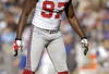 CHARLOTTE, NC - DECEMBER 10: Mathias Kiwanuka #97 of the New York Giants gets ready on the field during the game against the Carolina Panthers on December 10, 2006, at Bank of America Stadium in Charlotte, North Carolina. (Photo By Grant Halverson/Getty Images)