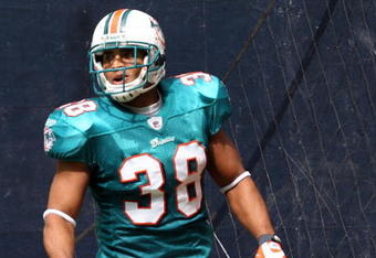 HOUSTON - OCTOBER 12:  Running back Patrick Cobbs #38 of the Miami Dolphins celebrates a touchdown against the Houston Texans in the first quarter at Reliant Stadium on October 12, 2008 in Houston, Texas.  (Photo by Ronald Martinez/Getty Images)