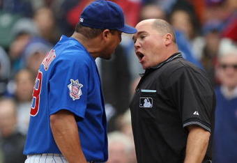 CHICAGO - MAY 27: Carlos Zambrano #38 of the Chicago Cubs argues with home plate umpire Mark Carlson #48 after a play at the plate in the 7th inning with Zambrano and Nyjer Morgan of the Pittsburgh Pirates on May 27, 2009 at Wrigley Field in Chicago, Illinois. The Cubs defeated the Pirates 5-2. (Photo by Jonathan Daniel/Getty Images)