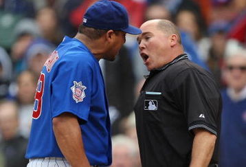 CHICAGO - MAY 27: Carlos Zambrano #38 of the Chicago Cubs argues with home plate umpire Mark Carlson #48 after a play at the plate in the 7th inning with Zambrano and Nyjer Morgan of the Pittsburgh Pirates on May 27, 2009 at Wrigley Field in Chicago, Illinois. The Cubs defeated the Pirates 5-2. (Photo by Jonathan Daniel/Getty Images)