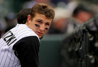 DENVER - APRIL 26:  Troy Tulowitzki #2 of the Colorado Rockies looks on from the dugout against the Los Angeles Dodgers at Coors Field on April 26, 2009 in Denver, Colorado. The Rockies and defeated Dodgers 10-4.  (Photo by Doug Pensinger/Getty Images)