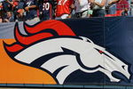 DENVER - SEPTEMBER 26:  Fans cheer on as the Denver Broncos host the San Diego Chargers on September 26, 2004 at Invesco Field in Denver, Colorado. The Broncos defeated the Chargers 23-13.  (Photo by Ronald Martinez/Getty Images)