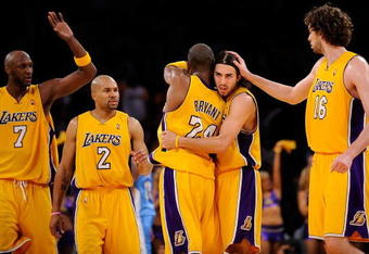 LOS ANGELES, CA - MAY 27:  (2nd R) Sasha Vujacic #18 of the Los Angeles Lakers is hugged by teammate Kobe Bryant #24 and greeted by teammates Lamar Odom #7, Derek Fisher #2 and Pau Gasol #16 of the Lakers in the second quarter against the Denver Nuggets in Game Five of the Western Conference Finals during the 2009 NBA Playoffs at Staples Center on May 27, 2009 in Los Angeles, California. NOTE TO USER: User expressly acknowledges and agrees that, by downloading and or using this photograph, User is consenting to the terms and conditions of the Getty Images License Agreement.  (Photo by Kevork Djansezian/Getty Images)