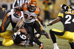 PITTSBURGH - NOVEMBER 20:  Cedric Benson #32 of the Cincinnati Bengals runs with the ball as  Ike Taylor #24 of the Pittsburgh Steelers defends during a first-quarter run on November 20, 2008 at Heinz Field in Pittsburgh, Pennsylvania.  (Photo by Gregory Shamus/Getty Images)