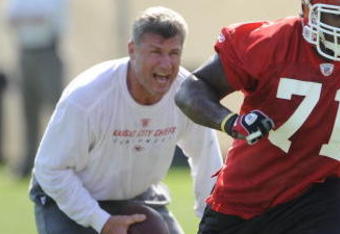 KANSAS CITY, MO - MAY 9:  Alex Magee #71 of the Kansas City Chiefs goes through a drill as defensive line coach TIm Krumrie looks on during a rookie minicamp at the Chiefs practice facility on May 9, 2009 in Kansas City, Missouri. (Photo by G. Newman Lowrance/Getty Images)