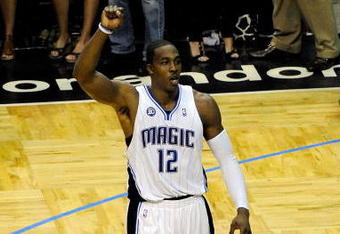 ORLANDO, FL - MAY 26:  Dwight Howard #12 of the Orlando Magic celebrates during overtime against the Cleveland Cavaliers in Game Four of the Eastern Conference Finals during the 2009 NBA Playoffs at the Amway Arena on May 26, 2009 in Orlando, Florida. The Orlando Magic defeated the Cleveland Cavaliers 116-114. NOTE TO USER: User expressly acknowledges and agrees that, by downloading and or using this photograph, User is consenting to the terms and conditions of the Getty Images License Agreement.  (Photo by Sam Greenwood/Getty Images)