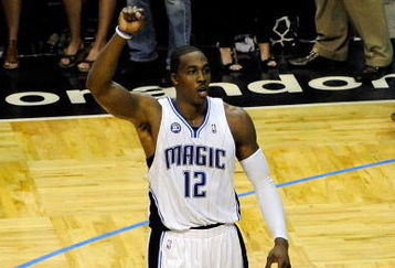 ORLANDO, FL - MAY 26:  Dwight Howard #12 of the Orlando Magic celebrates during overtime against the Cleveland Cavaliers in Game Four of the Eastern Conference Finals during the 2009 NBA Playoffs at the Amway Arena on May 26, 2009 in Orlando, Florida. The Orlando Magic defeated the Cleveland Cavaliers 116-114. NOTE TO USER: User expressly acknowledges and agrees that, by downloading and or using this photograph, User is consenting to the terms and conditions of the Getty Images License Agreement.  (Photo by Sam Greenwood/Getty Images)