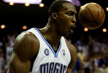 ORLANDO, FL - MAY 26:  Dwight Howard #12 of the Orlando Magic reacts after dunking against the Cleveland Cavaliers in Game Four of the Eastern Conference Finals during the 2009 NBA Playoffs at the Amway Arena on May 26, 2009 in Orlando, Florida. NOTE TO USER: User expressly acknowledges and agrees that, by downloading and or using this photograph, User is consenting to the terms and conditions of the Getty Images License Agreement.  (Photo by Elsa/Getty Images)