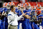 ATLANTA - DECEMBER 06:  Head coach Urban Meyer, quarterback Tim Tebow #15 and the Florida Gators prepare to face the Alabama Crimson Tide in the SEC Championship on December 6, 2008 at the Georgia Dome in Atlanta, Georgia.  (Photo by Kevin C. Cox/Getty Images)