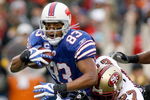 ORCHARD PARK, NY - NOVEMBER 30: Lee Evans #83  of the Buffalo Bills is tackled by Walt Harris #27 of the San Francisco 49ers  on November 30, 2008 at Ralph Wilson Stadium in Orchard Park, New York.  (Photo by Rick Stewart/Getty Images)