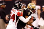 NEW ORLEANS - DECEMBER 07:  Devery Henderson #19 of the New Orleans Saints is tackled by Domonique Foxworth #24 and Keith Brooking #56 of the Atlanta Falcons on December 7, 2008 at the Superdome in New Orleans, Louisiana.  (Photo by Chris Graythen/Getty Images)