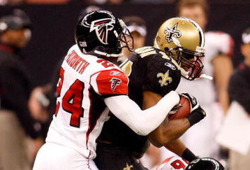 NEW ORLEANS - DECEMBER 07:  Devery Henderson #19 of the New Orleans Saints is tackled by Domonique Foxworth #24 and Keith Brooking #56 of the Atlanta Falcons on December 7, 2008 at the Superdome in New Orleans, Louisiana.  (Photo by Chris Graythen/Getty Images)