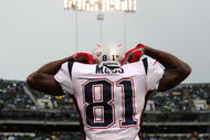 OAKLAND, CA - DECEMBER 14: Randy Moss #81 of the New England Patriots celeberates after scoring a touchdown against the Oakland Raiders during an NFL game on December 14, 2008 at the Oakland-Alameda County Coliseum in Oakland, California. (Photo by Jed Jacobsohn/Getty Images)