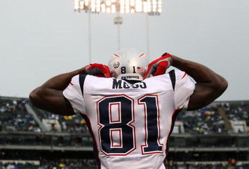 OAKLAND, CA - DECEMBER 14: Randy Moss #81 of the New England Patriots celeberates after scoring a touchdown against the Oakland Raiders during an NFL game on December 14, 2008 at the Oakland-Alameda County Coliseum in Oakland, California.  (Photo by Jed Jacobsohn/Getty Images)