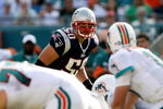 MIAMI - NOVEMBER 23:  Linebacker Mike Vrabel #50 of the New England Patriots looks in as quarterback Chad Pennington #10 of the Miami Dolphins prepares to take the snap at Dolphin Stadium on November 23, 2008 in Miami, Florida. The Patriots defeated the Dolphins 48-28.  (Photo by Doug Benc/Getty Images)