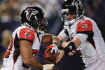 MINNEAPOLIS - DECEMBER 21: Michael Turner #33 of the Atlanta Falcons receives a handoff from quarterback Matt Ryan #2 during an NFL game against the Minnesota Vikings at the Hubert H. Humphrey Metrodome, on December 21, 2008 in Minneapolis, Minnesota.  (Photo by Tom Dahlin/Getty Images)