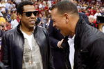 CLEVELAND - MAY 28:  Rapper/producer Jay Z and Alex Rodriguez of the New York Yankees talk before Game Five of the Eastern Conference Finals between the Cleveland Cavaliers and the Orlando Magic during the 2009 Playoffs at Quicken Loans Arena on May 28, 2009 in Cleveland, Ohio. NOTE TO USER: User expressly acknowledges and agrees that, by downloading and or using this photograph, User is consenting to the terms and conditions of the Getty Images License Agreement  (Photo by Gregory Shamus/Getty Images)