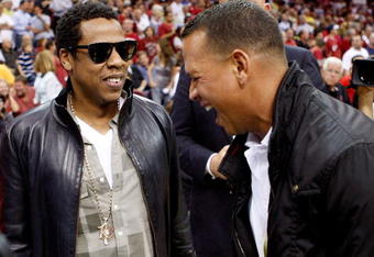 CLEVELAND - MAY 28:  Rapper/producer Jay Z and Alex Rodriguez of the New York Yankees talk before Game Five of the Eastern Conference Finals between the Cleveland Cavaliers and the Orlando Magic during the 2009 Playoffs at Quicken Loans Arena on May 28, 2009 in Cleveland, Ohio. NOTE TO USER: User expressly acknowledges and agrees that, by downloading and or using this photograph, User is consenting to the terms and conditions of the Getty Images License Agreement  (Photo by Gregory Shamus/Getty Images)