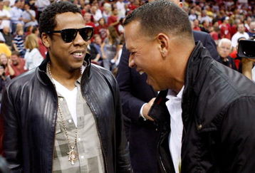 CLEVELAND - MAY 28:  Rapper/producer Jay Z and Alex Rodriguez of the New York Yankees talk before Game Five of the Eastern Conference Finals between the Cleveland Cavaliers and the Orlando Magic during the 2009 Playoffs at Quicken Loans Arena on May 28, 2009 in Cleveland, Ohio. NOTE TO USER: User expressly acknowledges and agrees that, by downloading and or using this photograph, User is consenting to the terms and conditions of the Getty Images License Agreement  (Photo by Gregory Shamus/Getty Images)