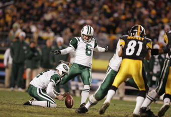 PITTSBURGH - DECEMBER 12:  Kicker Doug Brien #6 of the New York Jets attempts to score off a hold by punter Toby Gowin #4 during the game against the Pittsburgh Steelers on December 12, 2004 at Heinz Field in Pittsburgh, Pennsylvania. The Steelers won 17-7. (Photo by Al Bello/Getty Images)