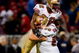 ST. LOUIS, MO - DECEMBER 21:  Michael Lewis #32 and Eric Heitmann #66 of the San Francisco 49ers celebrate during the game against the St. Louis Rams at the Edward Jones Dome on December 21, 2008 in St. Louis, Missouri. The 49ers won 17-16. (Photo by Dilip Vishwanat/Getty Images) 