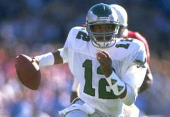 1990:  PHILADELPHIA EAGLES QUARTERBACK RANDALL CUNNINGHAM SCRAMBLES FOR EXTRA YARDAGE DURING THE EAGLES GAME VERSUS THE PHOENIX CARDINALS AT SUN DEVIL STADIUM IN TEMPE, ARIZONA.  MANDATORY CREDIT:  MIKE POWELL/ALLSPORT