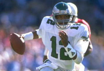 1990:  PHILADELPHIA EAGLES QUARTERBACK RANDALL CUNNINGHAM SCRAMBLES FOR EXTRA YARDAGE DURING THE EAGLES GAME VERSUS THE PHOENIX CARDINALS AT SUN DEVIL STADIUM IN TEMPE, ARIZONA.  MANDATORY CREDIT:  MIKE POWELL/ALLSPORT