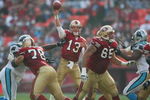 SAN FRANCISCO - NOVEMBER 14:  Quarterback Tim Rattay #13 of the San Francisco 49ers passes as offensive tackle Scott Gragg #78 and offensive guard Justin Smiley #65 block against the Carolina Panthers at Monster Park on November 14, 2004 in San Francisco, California. (Photo by Jed Jacobsohn/Getty Images)