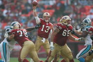 SAN FRANCISCO - NOVEMBER 14:  Quarterback Tim Rattay #13 of the San Francisco 49ers passes as offensive tackle Scott Gragg #78 and offensive guard Justin Smiley #65 block against the Carolina Panthers at Monster Park on November 14, 2004 in San Francisco, California. (Photo by Jed Jacobsohn/Getty Images)