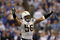 INDIANAPOLIS - JANUARY 13:  Shawne Merriman #56 of the San Diego Chargers celebrates after their 28-24 win against the Indianapolis Colts during their AFC Divisional Playoff game at the RCA Dome on January 13, 2008 in Indianapolis, Indiana.  (Photo by Doug Pensinger/Getty Images)