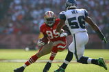 SAN FRANCISCO - OCTOBER 26:  Tight end Vernon Davis #85 of the San Francisco 49ers carries the ball while being pursued by Leroy Hill #56 of the Seattle Seahawks in the fourth quarter at Candlestick Park on October 26, 2008 in San Francisco, California. The Seahawks defeated the 49ers 34-13.  (Photo by Jeff Gross/Getty Images)