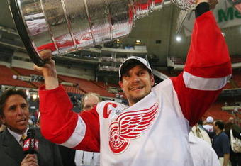 PITTSBURGH - JUNE 04: Nicklas Lidstrom #5 of the Detroit Red Wings celebrates with the Stanley Cup after defeating the Pittsburgh Penguins in game six of the 2008 NHL Stanley Cup Finals at Mellon Arena on June 4, 2008 in Pittsburgh. Pennsylvania. The Red Wings defeated the Penguins 3-2 to win the Stanley Cup Finals 4 games to 2. (Photo by Bruce Bennett/Getty Images)