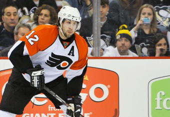 PITTSBURGH - APRIL 17:  Forward Simon Gagne #12 of the Philadelphia Flyers skates with the puck against the Pittsburgh Penguins during Game Two of the Eastern Conference Quarterfinals of the 2009 Stanley Cup Playoffs on April 17, 2009 at Mellon Arena in Pittsburgh, Pennsylvania.  (Photo by Jamie Sabau/Getty Images)