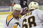 8 May 2001:  Mario Lemieux #66 of the Pittsburgh Penguins gives a strained smile to teammate Jaromir Jagr #68 after Lemieux collided with Jason Woolley #5 of the Buffalo Sabres during game six of the Eastern Conference Semi Finals of the 2001 Stanley Cup Playoffs at the Mellon Arena in Pittsburgh, Pennsylvania. <<DIGITAL IMAGE>> Mandatory Credit: Doug Pensinger/ALLSPORT