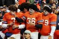 DENVER - OCTOBER 30:  Denver Broncos fans cheer on their team against the Philadelphia Eagles on October 30, 2005 before Halloween at Invesco Field at Mile High in Denver, Colorado.  The Broncos won 49-21.  (Photo by Brian Bahr/Getty Images)