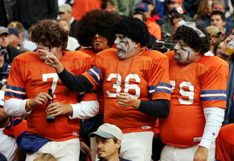 DENVER - OCTOBER 30:  Denver Broncos fans cheer on their team against the Philadelphia Eagles on October 30, 2005 before Halloween at Invesco Field at Mile High in Denver, Colorado.  The Broncos won 49-21.  (Photo by Brian Bahr/Getty Images)