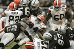 OAKLAND, CA - OCTOBER 01:  Reuben Droughns #34 of the Cleveland Browns is tackled by Kirk Morrison #52 of the Oakland Raiders October 1, 2006 at McAfee Coliseum in Oakland, California.  (Photo by Jonathan Ferrey/Getty Images)