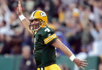 GREEN BAY, WI - OCTOBER 24:  Brett Favre #4 of the Green Bay Packers celebrates a touchdown run by teammate Ahman Green  against of the Dallas Cowboys at Lambeau Field on October 24, 2004 in Green Bay, Wisconsin. The Packers defeated the Cowboys 41-20. (Photo by Jonathan Daniel/Getty Images)