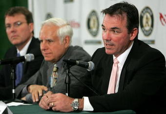 OAKLAND, CA - APRIL 1:  Oakland Athletics Vice President and General Manager Billy Beane (R) speaks during a news conference as Lewis Wolff, new co-owner and managing partner of the Athletics and Michael Crowley, (R) Athletics President look on  April 1, 2005 in Oakland, California. Major League Baseball approved the sale of the Athletics on March 30th to a group headed by Wolff which includes his son, Keith Wolff, and billionaire John Fisher, son of Gap founder Donald Fisher.  (Photo by Justin Sullivan/Getty Images)