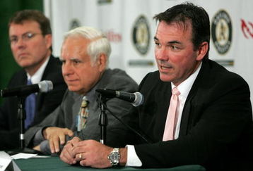 OAKLAND, CA - APRIL 1:  Oakland Athletics Vice President and General Manager Billy Beane (R) speaks during a news conference as Lewis Wolff, new co-owner and managing partner of the Athletics and Michael Crowley, (R) Athletics President look on  April 1, 2005 in Oakland, California. Major League Baseball approved the sale of the Athletics on March 30th to a group headed by Wolff which includes his son, Keith Wolff, and billionaire John Fisher, son of Gap founder Donald Fisher.  (Photo by Justin Sullivan/Getty Images)