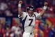 31 Jan 1999: Quarterback John Elway #7 of the Denver Broncos celebrates the first touchdown during the first quarter of Super Bowl XXXIII against the Atlanta Falcons at Pro Player Stadium in Miami, Florida. The Broncos defeated the Falcons 34-19 to win their scond consecutive Super Bowl.