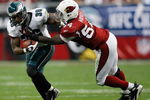 GLENDALE, AZ - JANUARY 18:  Running back Brian Westbrook #36 of the Philadelphia Eagles is tackled by linebacker Gerald Hayes #54 of the Arizona Cardinals during the NFC championship game on January 18, 2009 at University of Phoenix Stadium in Glendale, Arizona.  (Photo by Chris Graythen/Getty Images)