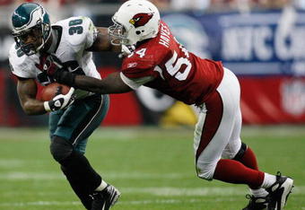 GLENDALE, AZ - JANUARY 18:  Running back Brian Westbrook #36 of the Philadelphia Eagles is tackled by linebacker Gerald Hayes #54 of the Arizona Cardinals during the NFC championship game on January 18, 2009 at University of Phoenix Stadium in Glendale, Arizona.  (Photo by Chris Graythen/Getty Images)
